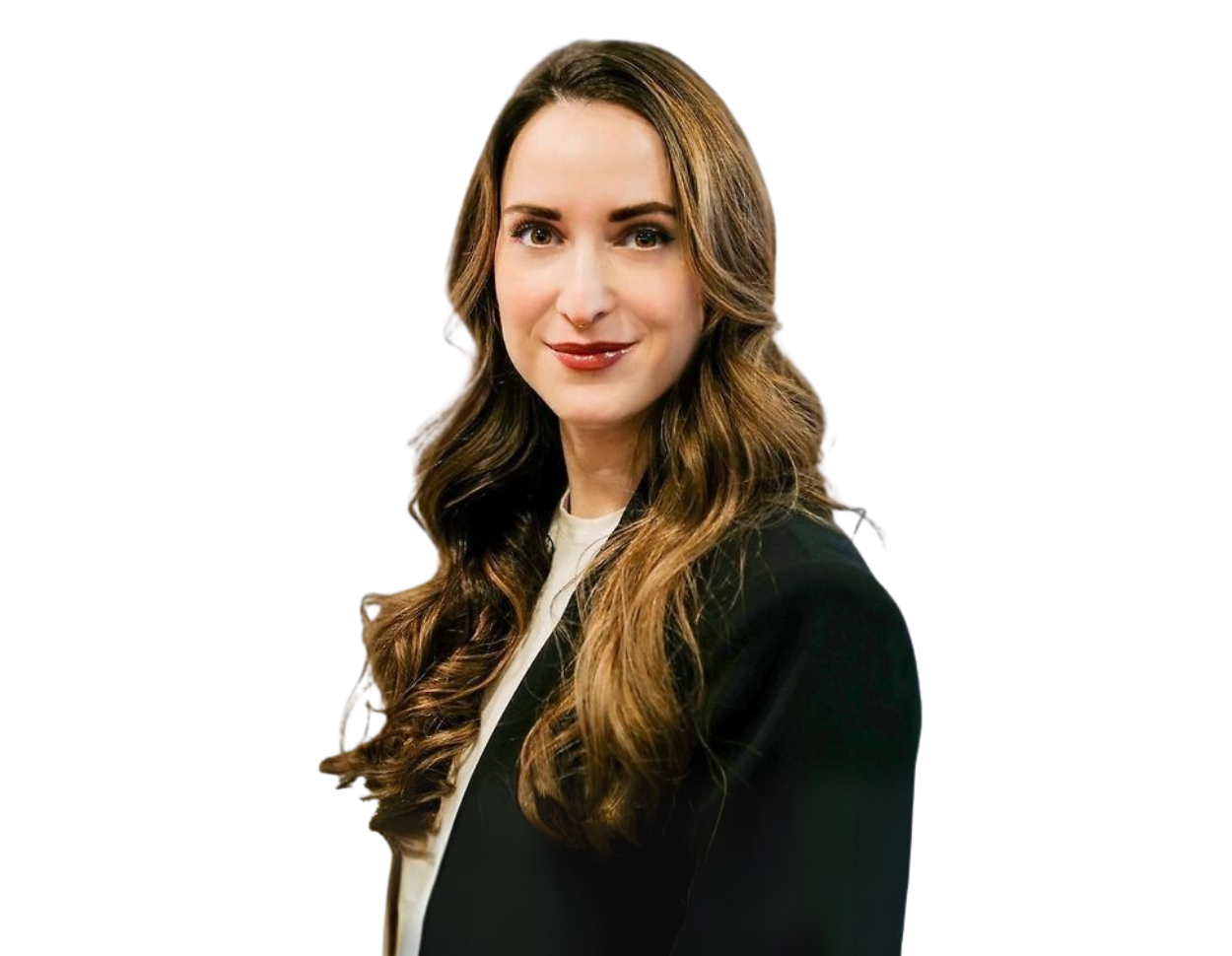 Confident woman with long wavy brown hair wearing a black blazer over a white top, posing against a transparent background. She has a poised expression and a professional appearance suitable for corporate or business profiles.