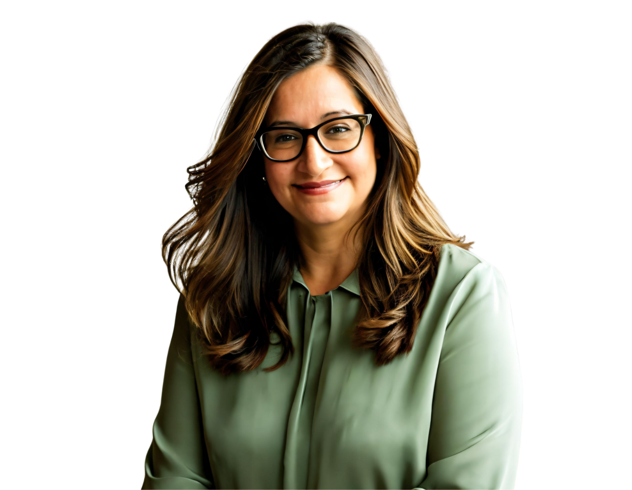 A woman with long, wavy brown hair and glasses smiles softly while wearing a sage green blouse. She is posed confidently with her hands loosely clasped, suggesting a warm and approachable demeanor.