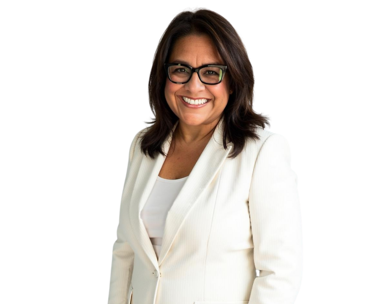 Lynda Jensen wearing a white blazer over a light top, posed against a light blue and white geometric background.