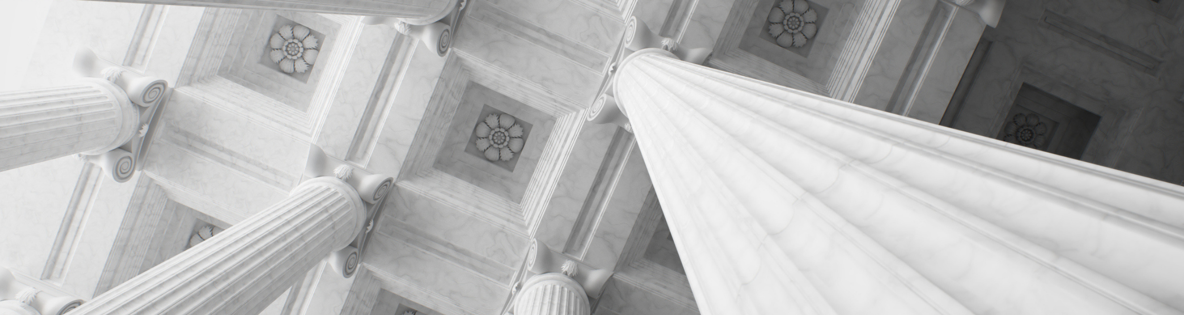 Looking up at court room ceiling columns with decorative flowers on the ceiling