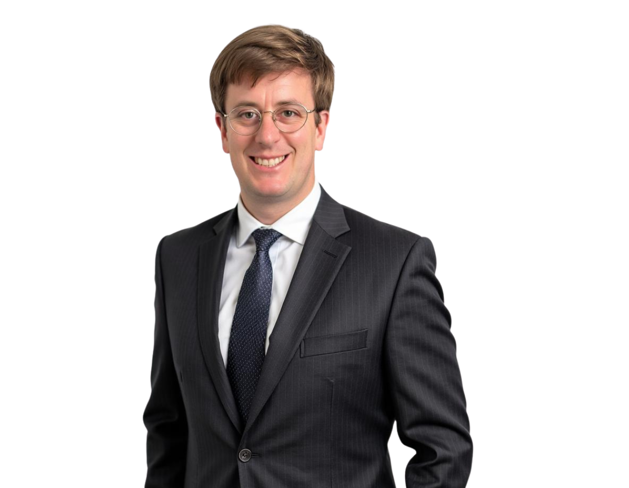 A young man in a dark pinstripe suit and navy tie stands smiling confidently. He has short brown hair, wears glasses, and is posed against a transparent background, suggesting a professional headshot or business profile photo.