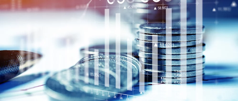 Money and business concept. Reporting charts on investment and success against the background of coins