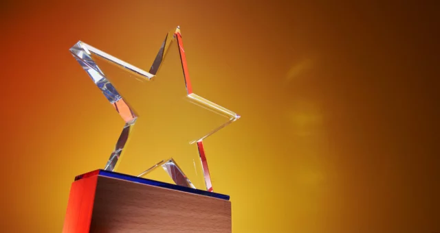 Sunset background with a glass star trophy