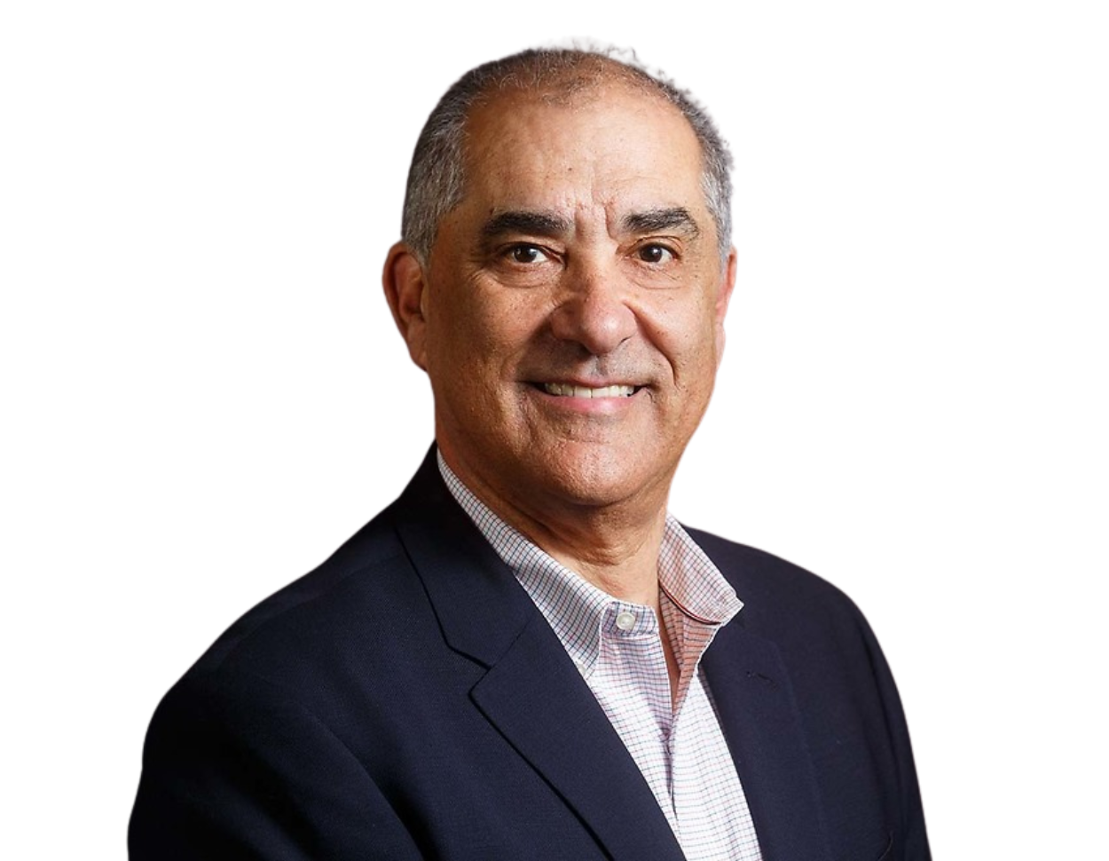 Frank Shuster wearing a dark blazer over a light checkered shirt against a plain background.