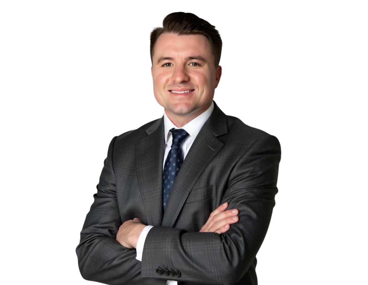 Jacob Freeland in a light gray suit, white dress shirt, and black tie poses against a plain background. He has neatly styled dark hair and is looking directly at the camera in a professional headshot.