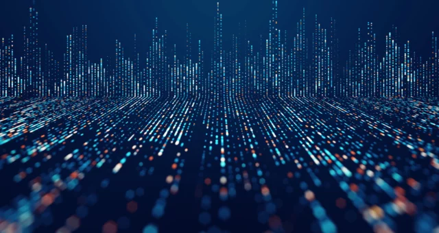 Abstract digital landscape of glowing blue and orange dots forming vertical lines, resembling a futuristic city skyline or data visualization. The perspective creates depth, symbolizing big data, analytics, and advanced technology.