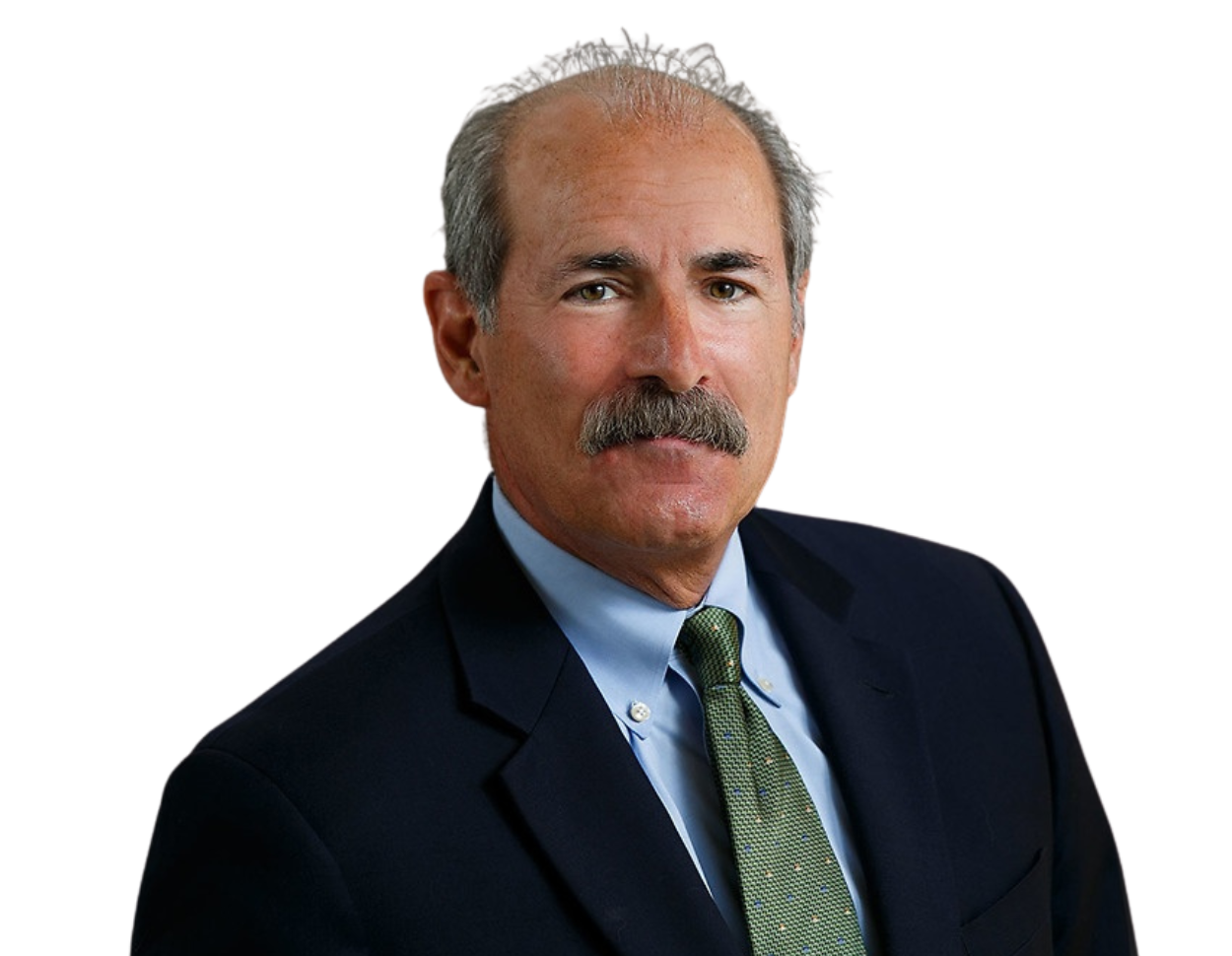 Bill Principe wearing a dark suit, light blue shirt, and green tie against a plain background.