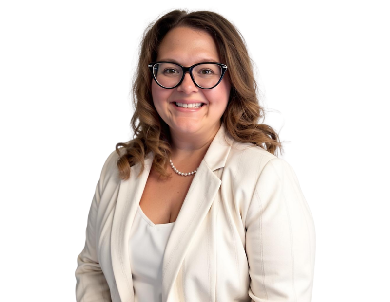 Headshot of Nicole Davies wearing black glasses, a white blazer, and a pearl necklace, posed in front of a light blue and white geometric background.