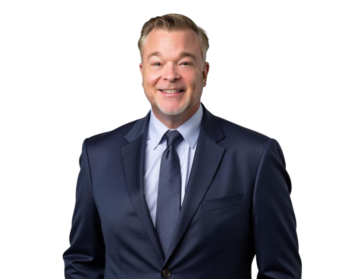 Jason Cherry in a dark navy suit and tie smiles while standing against a light blue and white geometric background.