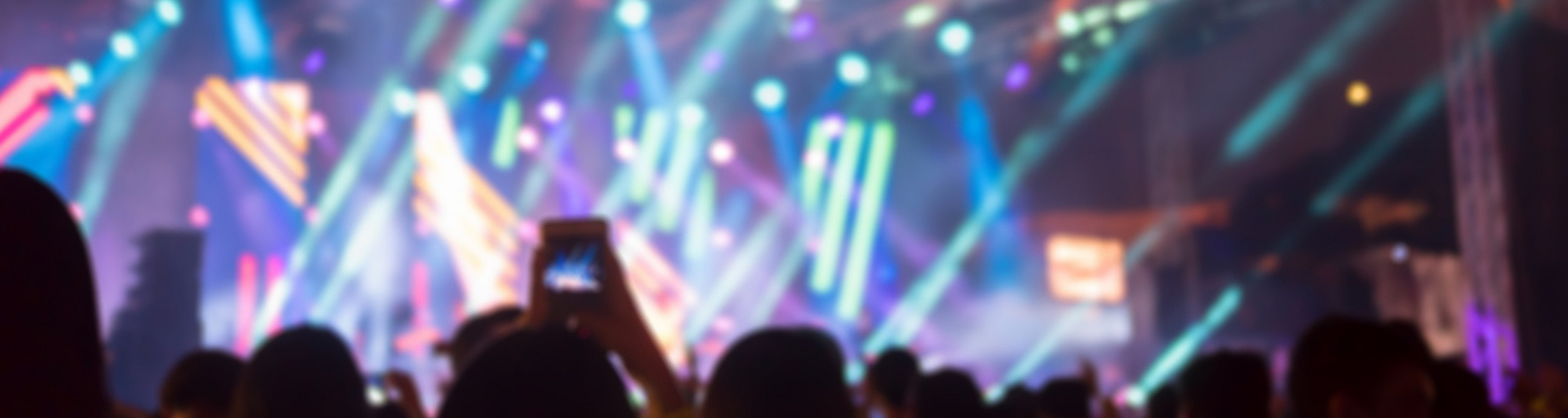 Blurred background : Bokeh lighting in outdoor concert with cheering audience.