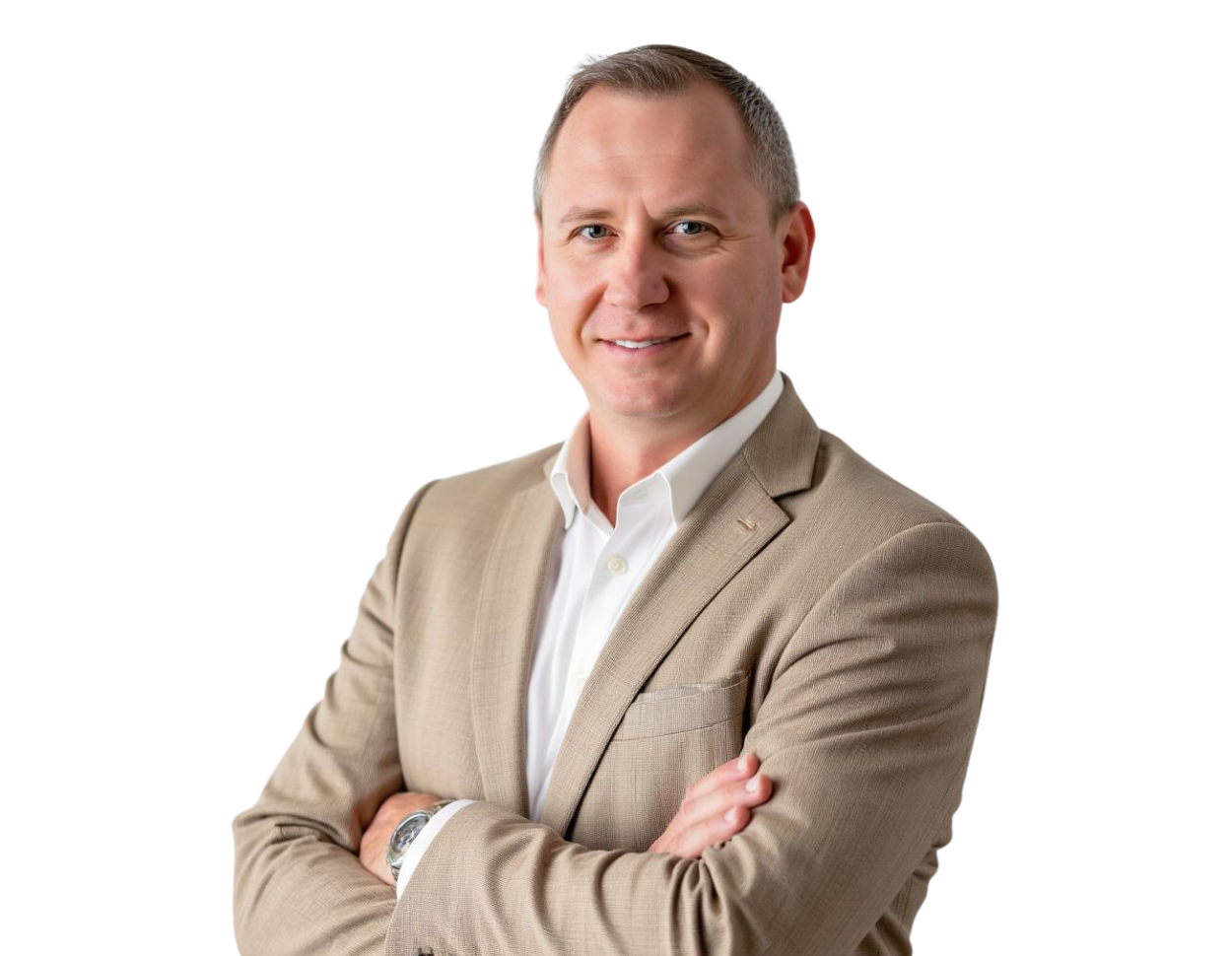 Jesse Bannon wears a beige suit jacket over a white shirt, smiling with arms crossed against a light blue and white geometric background.