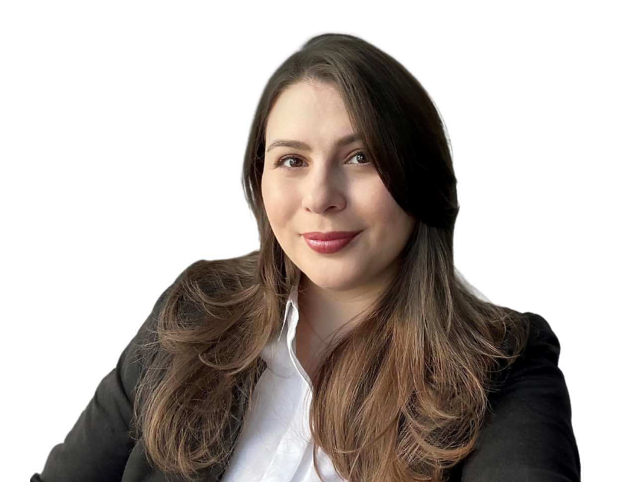 A woman with long, wavy brown hair and natural makeup, smiling softly in a professional headshot. She is wearing a black blazer over a white button-up shirt, set against a plain background.