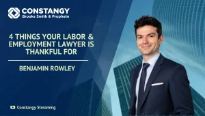 Benjamin Rowley is smiling and wearing a suit. The text reads: ‘4 Things Your Labor & Employment Lawyer Is Thankful For.’ The background includes blue geometric shapes and tall glass office buildings, with the Constangy logo at the top.