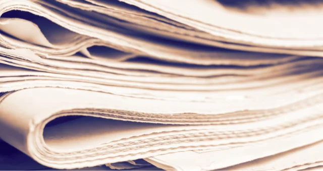 Stack of newspapers, rolled-up