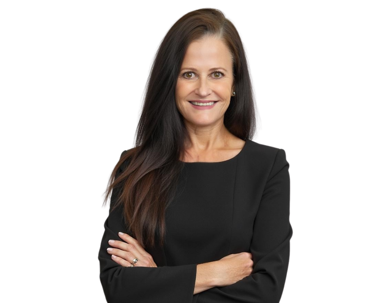 Professional woman with long dark hair wearing a black dress, smiling with arms crossed.