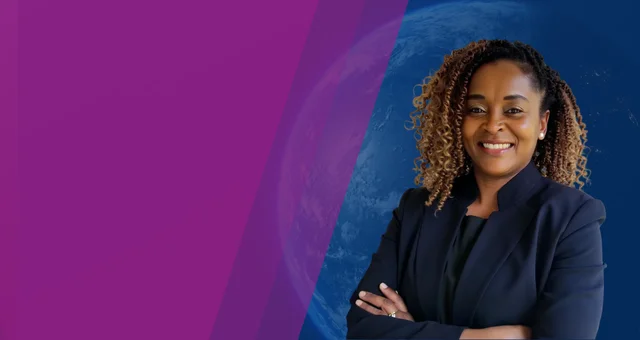 Professional headshot of Barbara Kihumba smiling with her arms crossed, wearing a navy blazer against a purple and blue background with a subtle globe design. The confident pose and global themed backdrop highlight Barbara Kihumba as a thought leader in t