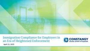 Constangy Brooks Smith & Prophete webinar title slide. The background shows a translucent overlay of teal and yellow hues with a photo of people meeting around a table in a modern office. The text reads: ‘Immigration Compliance for Employers in an Era of