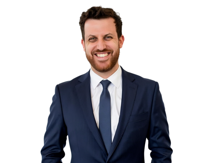 Jason Friedman in a dark navy suit and tie smiles against a light blue and white geometric background.