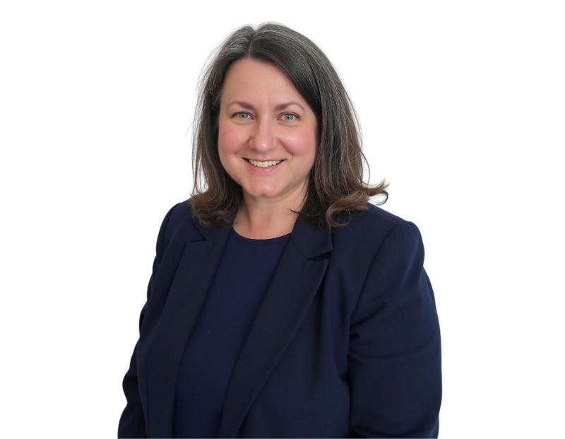 Laura Balson wearing a navy blazer over a matching navy top, posed against a light blue and white geometric background.