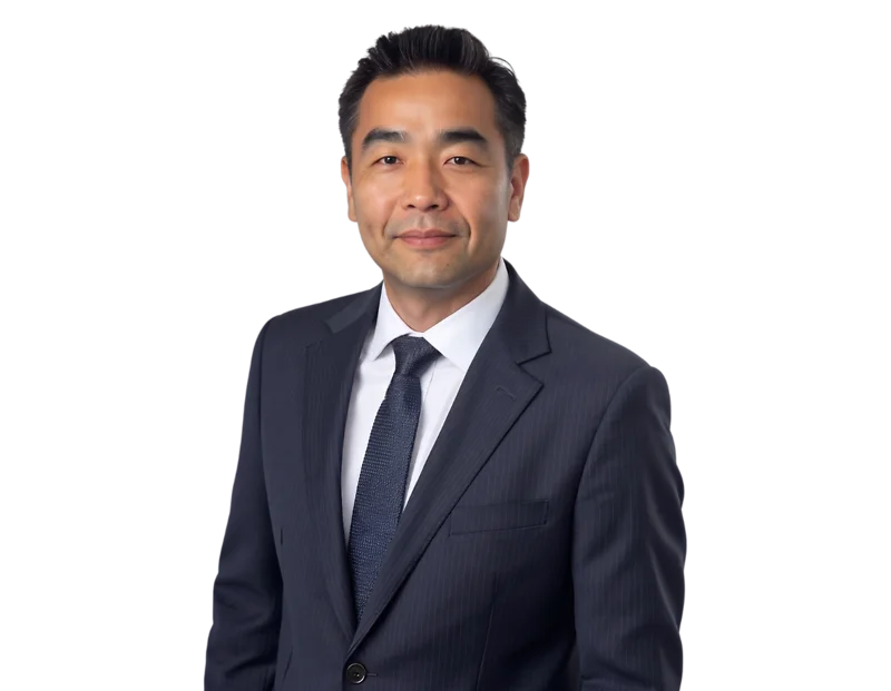 Andrew Pak, Partner on the Constangy Cyber Team based in Orange County, California, wears a navy pinstripe suit, white dress shirt, and dark tie in a professional headshot. He faces the camera with a slight smile against a plain white background, creating