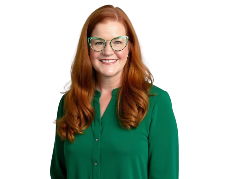 Professional photo of Lindsay Nickle wearing green glasses and a green blouse. She is standing against a transparent background and looking directly at the camera.