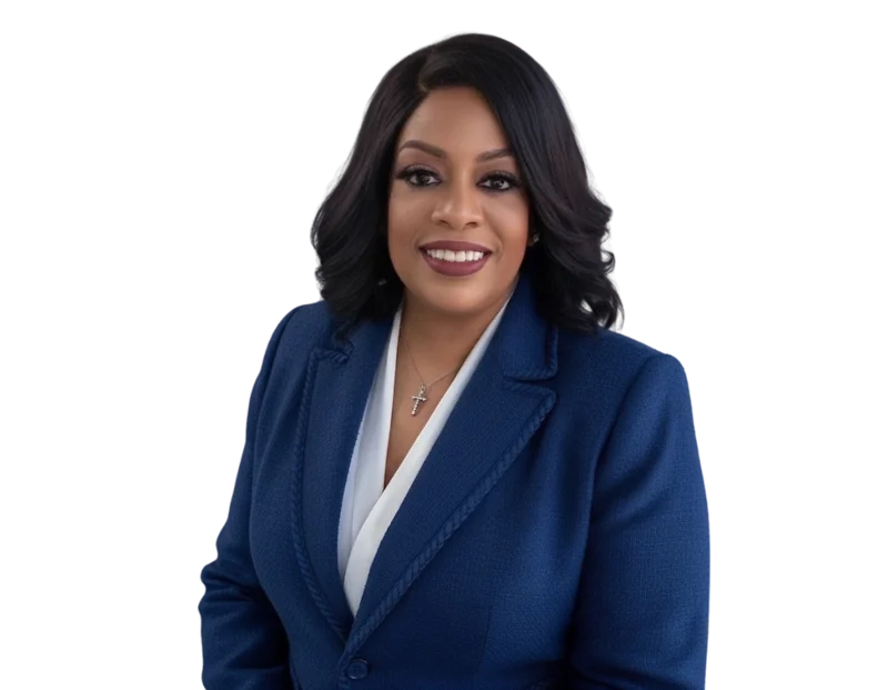 Kim Talley wearing a navy blazer over a white top and a silver necklace, posed against a light blue and white geometric background.