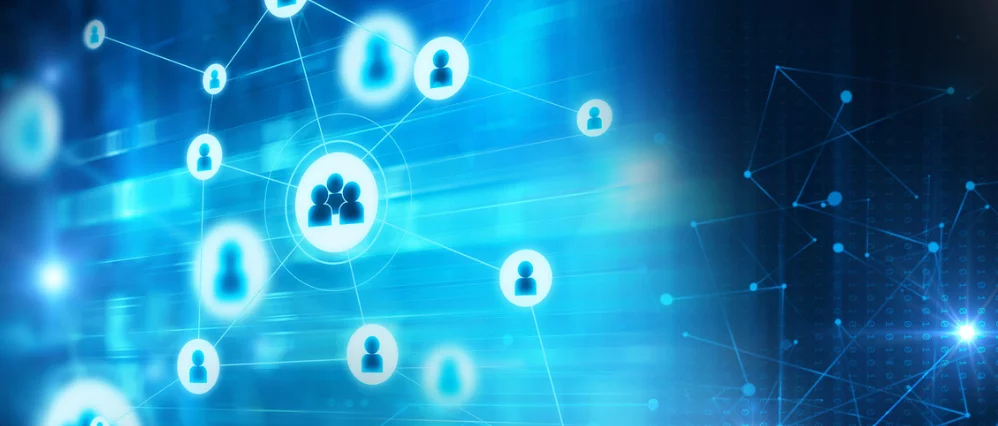 Abstract blue digital background featuring glowing user icons connected by thin lines and nodes across the image. A larger central group icon is highlighted, with smaller individual profile symbols radiating outward in a network pattern.