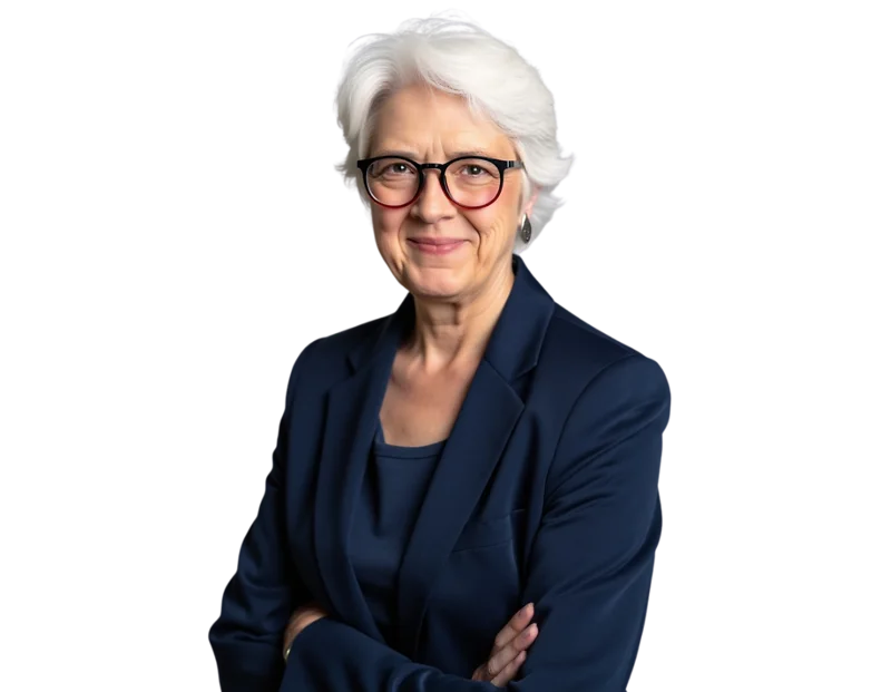 Professional headshot of Jo Bennett wearing glasses, a navy blazer, and a navy top, smiling with her arms crossed.
