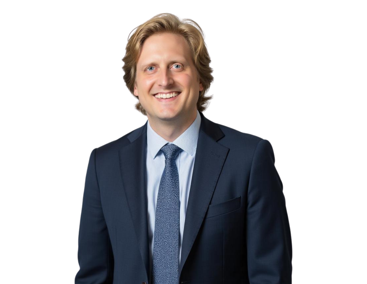 Evan Jarrold smiling in a dark navy suit with a light blue shirt and patterned tie, posed against a transparent background in a professional headshot style.