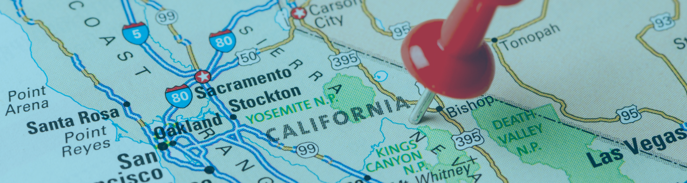 Close-up of a map of California with a red pushpin. Image highlights the state-specific focus of the California Snapshot blog on workplace and HR issues tailored for human resources professionals.