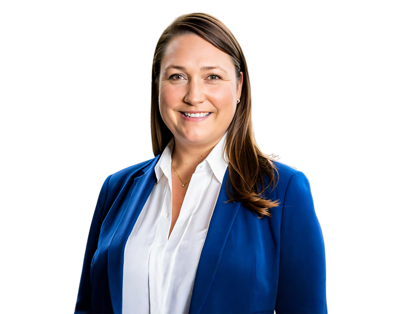 A woman with straight, shoulder-length brown hair smiles confidently while wearing a royal blue blazer over a white blouse. Her professional attire and posture convey a polished and approachable demeanor.