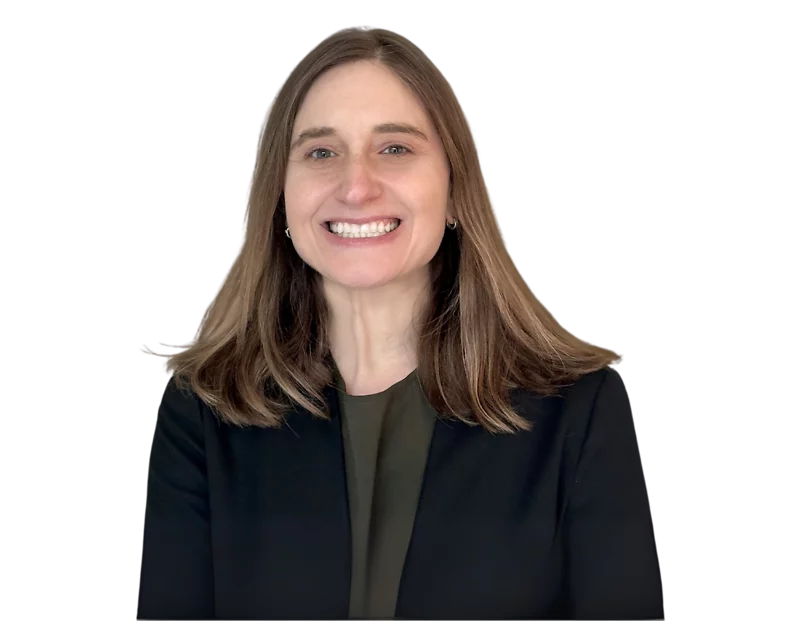 Melissa Sachs smiling in a professional headshot, wearing a dark blazer over an olive green top, with straight brown hair parted to the side and a transparent background.