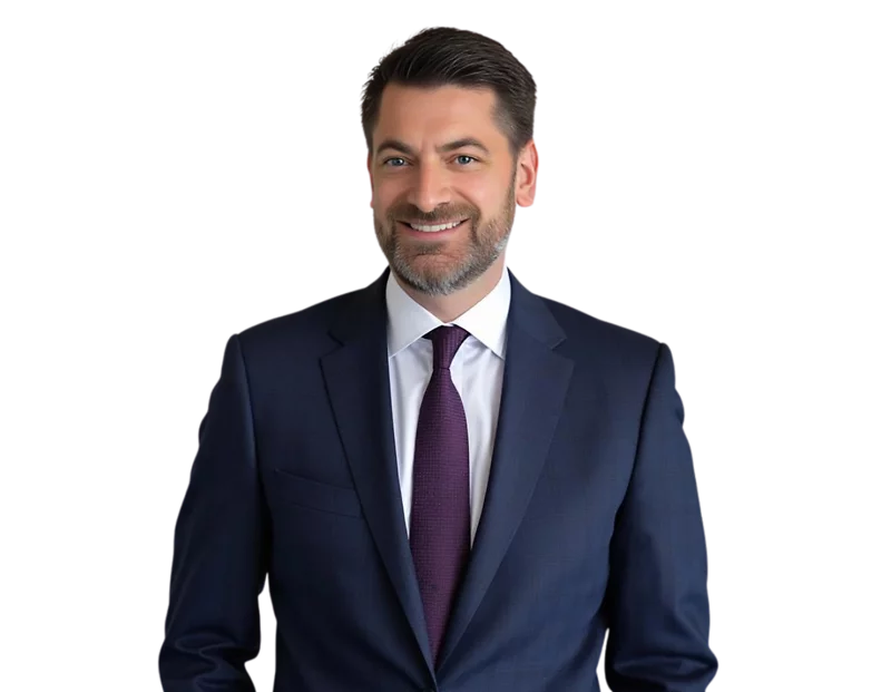 Allen Sattler, Constangy Cyber Team Vice Chair, smiling man in a dark navy suit with a white shirt and deep purple tie, posed against a transparent background. He has neatly styled dark hair and a short beard, projecting a professional and approachable de
