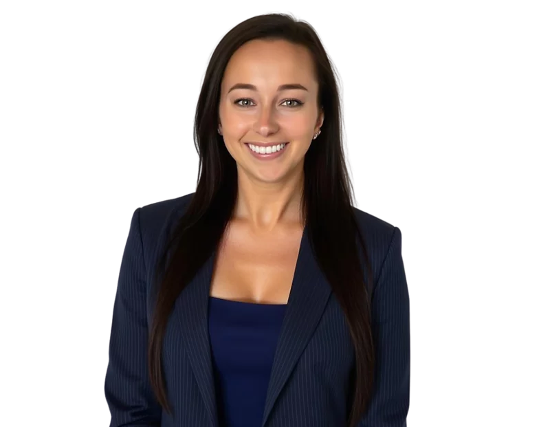 Smiling woman with long straight dark hair wearing a navy pinstripe blazer over a matching navy top. She is facing forward against a transparent background.