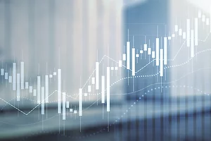 Abstract financial background featuring white candlestick charts, dotted lines, and bar graphs over a blurred blue-toned cityscape. The image conveys concepts of stock market trends, investment analysis, and economic growth.