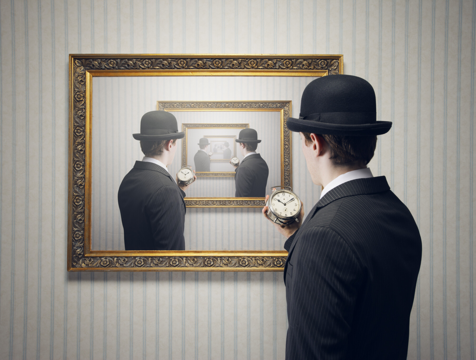 Surreal image of a man in a pinstripe suit and bowler hat holding an alarm clock, staring into a framed picture that reflects an infinite loop of himself doing the same. The scene creates a visual illusion of endless repetition, symbolizing themes of time, perception, and recursion.