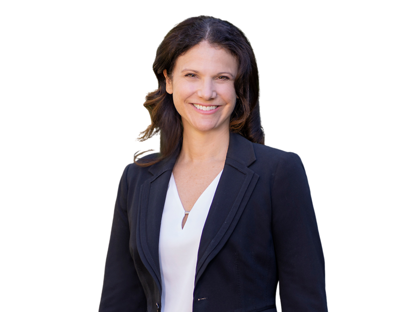 Lara de Leon wearing a black blazer over a white blouse, posed against a light blue and white geometric background.