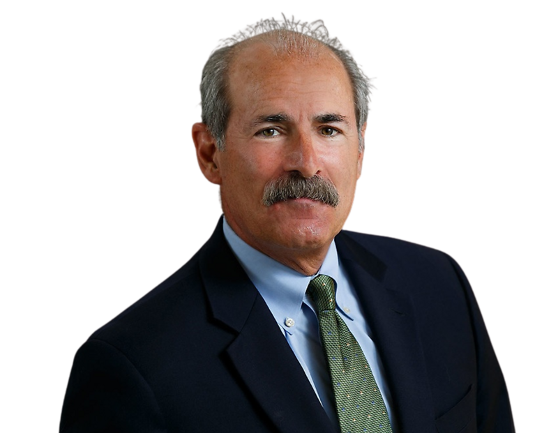 Bill Principe wearing a dark suit, light blue shirt, and green tie against a plain background.