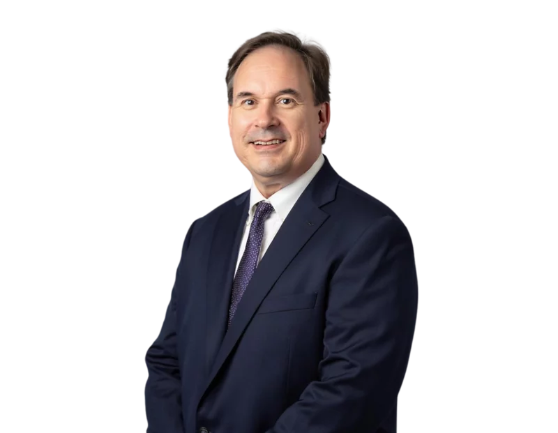 Ray Poole, labor and employment attorney in Jacksonville, Florida, wearing a navy suit and smiling.