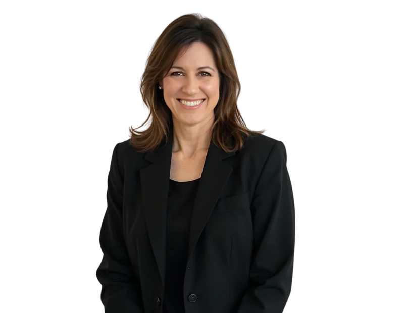 Angela Rapko wearing a black blazer and black top, posed against a light blue and white geometric background.
