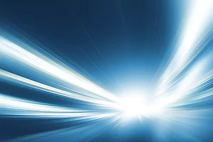Abstract digital illustration of bright white and blue light beams radiating from a central point, creating a sense of speed and motion. The streaks blend into deep blue tones, giving the impression of traveling quickly through space or energy waves.